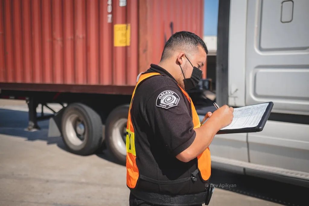 A Galaxy officer checking a load at a container trailer